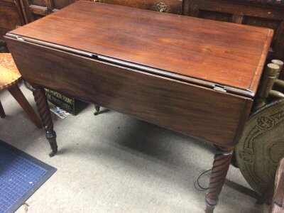 An Early Victorian mahogany Pembroke table with twin flap and twist turned legs. Fitted with a single drawer.