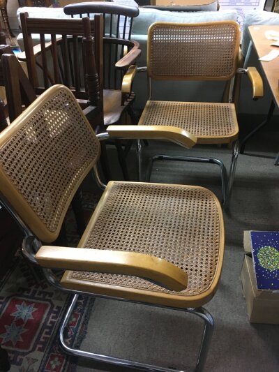 A pair of mid 20th Century design open arm chairs, after Marcel Breuer.