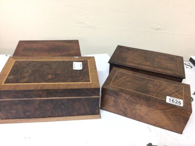 Four nice walnut and mahogany boxes with cross-banded edge and box wood inlay.  (4) 25x15cm