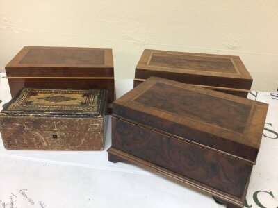 Three mahogany and satinwood boxes and one other smaller trinket box.
