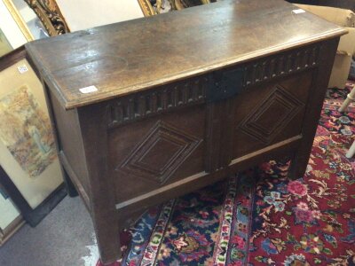 A Nice size Carved oak 18th century chest with a hinged top above carved panels. With traditional original split pin hinges and external lock plate 95x43cm