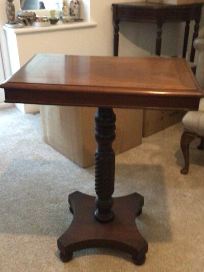 A Victorian mahogany occasional table with a rectangular top on a spiral column.