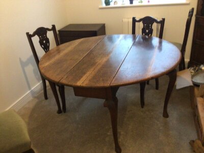An 18th century George III oak drop leaf table and Edwardian chairs. NO RESERVE.