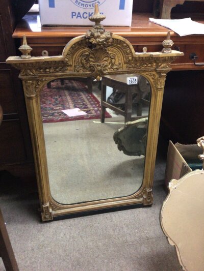A Victorian gilt Gesso mirror with raised moulded pilasters and shell motifs and two other gilt mirrors Height 90cm