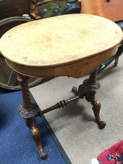 A walnut work sewing box with carved feet design, carved and inlaid interior. 62cm wide 70cm tall