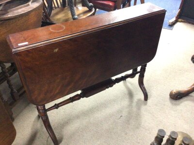 A Victorian walnut Sutherland table with a twin flap top on turned legs