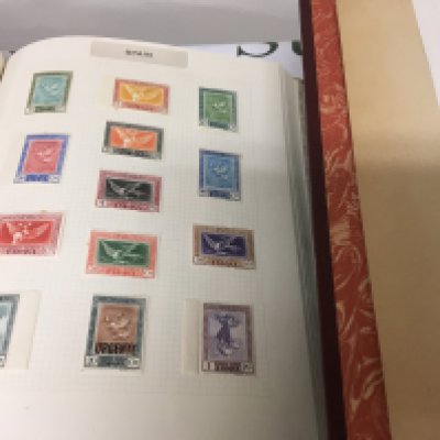 A Box containing Six albums of stamps including American stamps two albums of QEII stamps unmounted mint and other world stamps- NO RESERVE