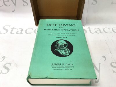 Deep diving and submarine operations. A Manual for deep sea divers and compression air workers hardcover book with display case.