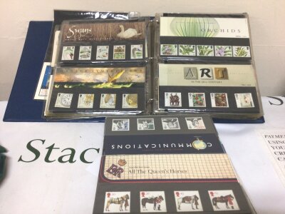 A collection of Presentation packs British Pictorial stamps and an album containing British stamp packs