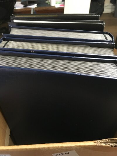 A box containing five stock books various world stamps .