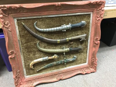 Framed collection of five 19th century North African knives. Frame size 70x64cm