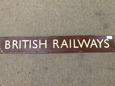 A British Railway (WR) brown and cream enamel notice board heading. 69cm wide 10cm tall