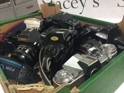 Six vintage SLR cameras including Canon, Pentax , Yashica , Minolta , Olympus