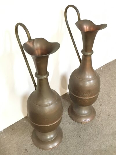 A pair of large copper urns. 73cm tall