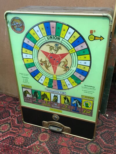 A vintage German wall mounted horse game, dated 1959. 48cm wide, 20cm long , 72cm tall