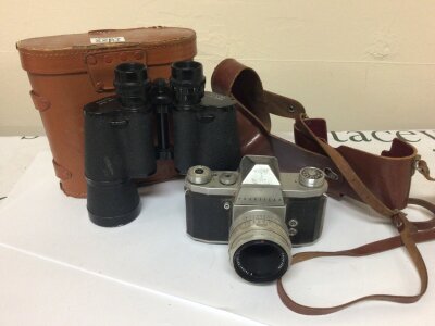 A pair of binoculars and a Praktica lV camera (2)
