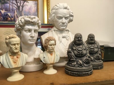 A collection of busts and figures features several classical and cultural figures, primarily including busts of famous European composers and figures from art, two Buddha figures . 21 to 45cm tall No reserve