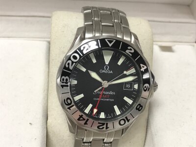 Omega Seamaster GMT "50th Anniversary" featuring a distinctive stainless steel bidirectional bezel with a black and silver 24-hour bezel. Box and one card. Seen running.