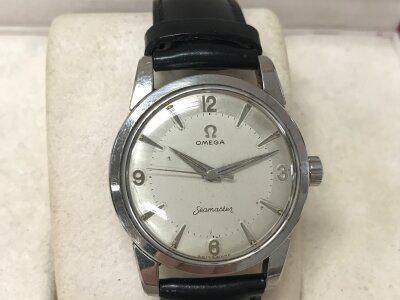 A vintage omega seamaster on black leather strap. Approximately 34mm case. Seen running.