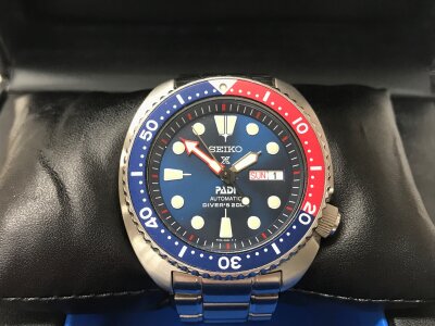 Seiko Prospex "Turtle" PADI Special Edition automatic diver watch features a distinctive blue dial and a red-and-blue "Pepsi" bezel. Comes with box and papers, seen running.