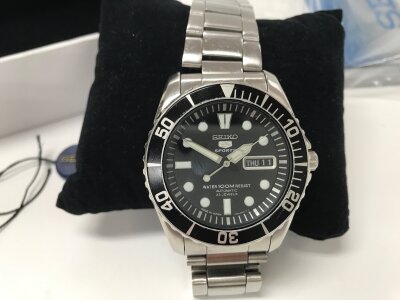 Seiko 5 Sports "Sea Urchin" automatic watch features a black dial and a stainless steel bracelet.