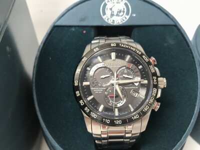Citizen Eco-Drive Perpetual Chrono A-T watch features a stainless steel bracelet and a black dial with sapphire crystal. Boxed. Seen running.
