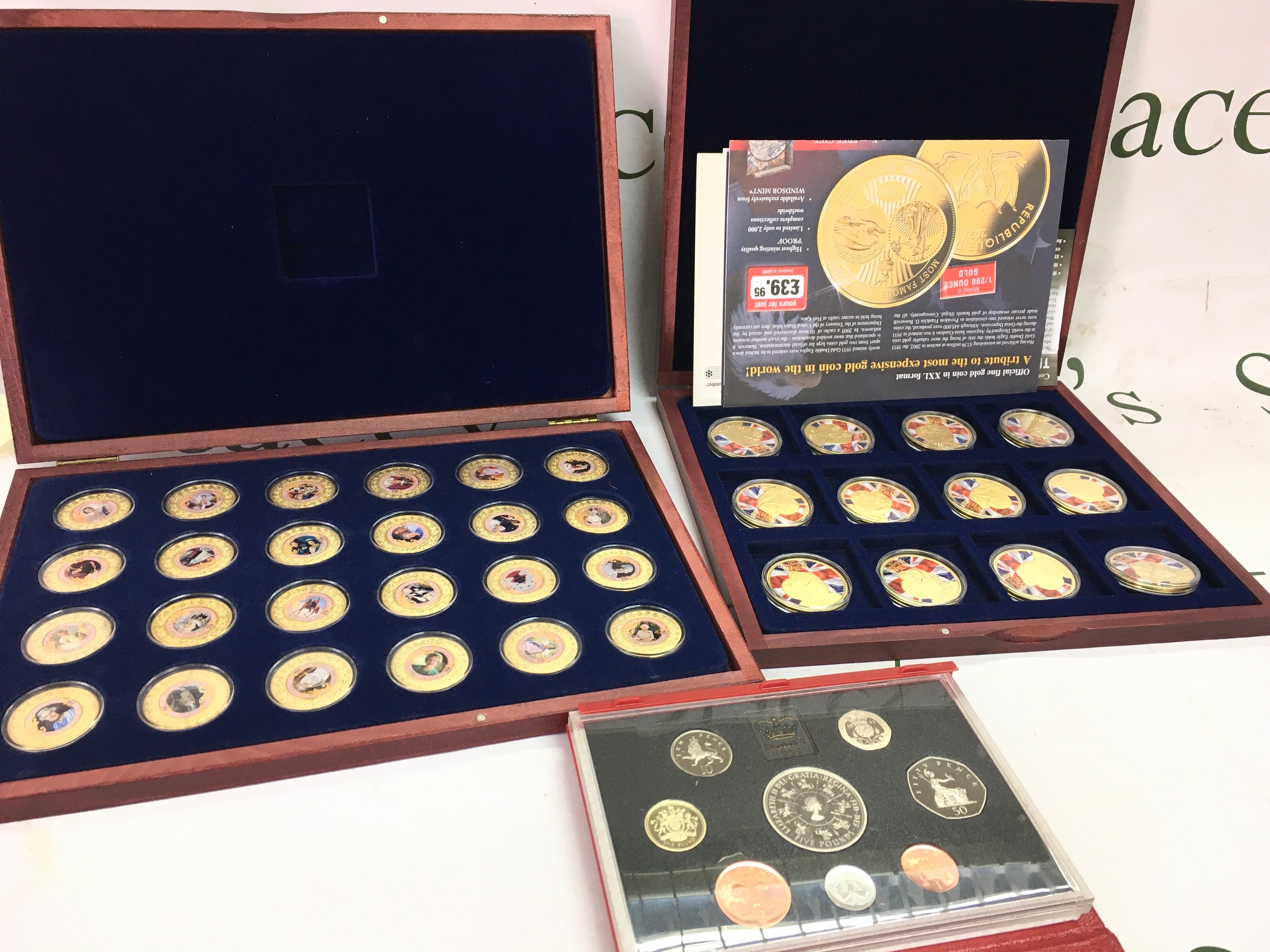 A collection of coins including an Elizabeth II set, 75th anniversary of WW2 set, 1993 set 