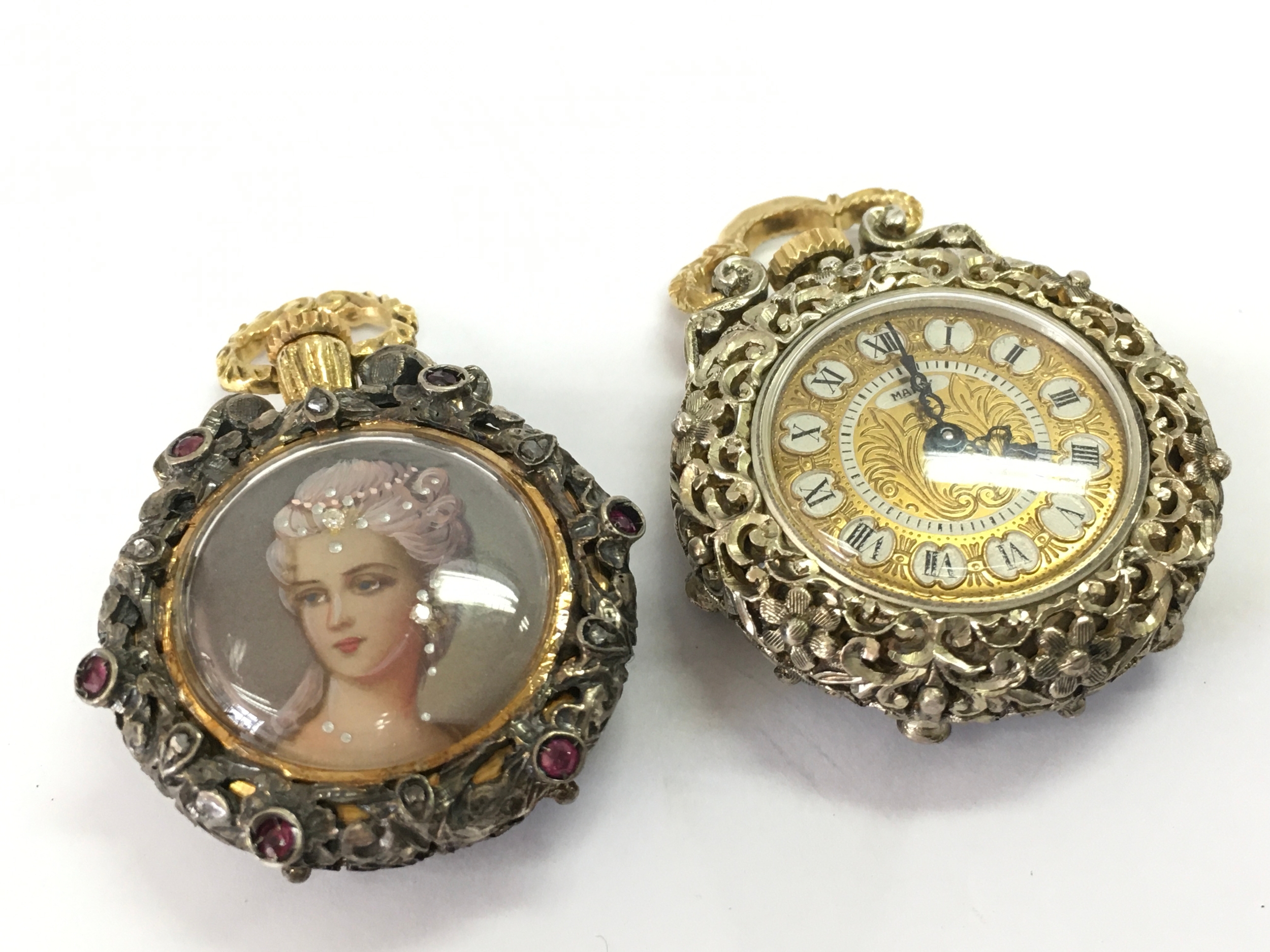 Two fob watches featuring intricate enameled cases and portrait plaques. 3cm wide