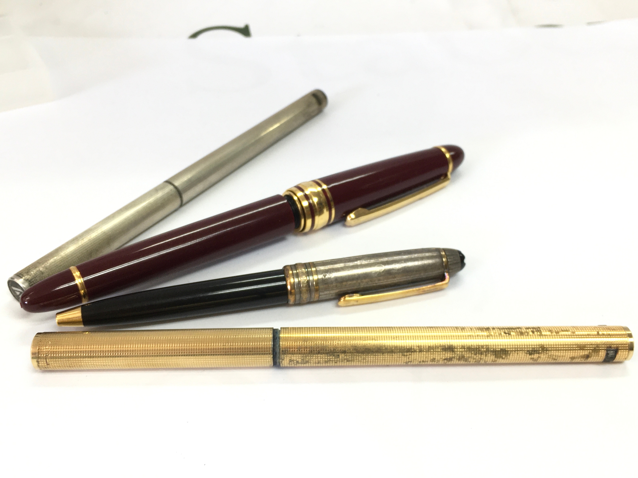Four pens including Mont Blanc, Aurora and a cased Mont Blanc pen