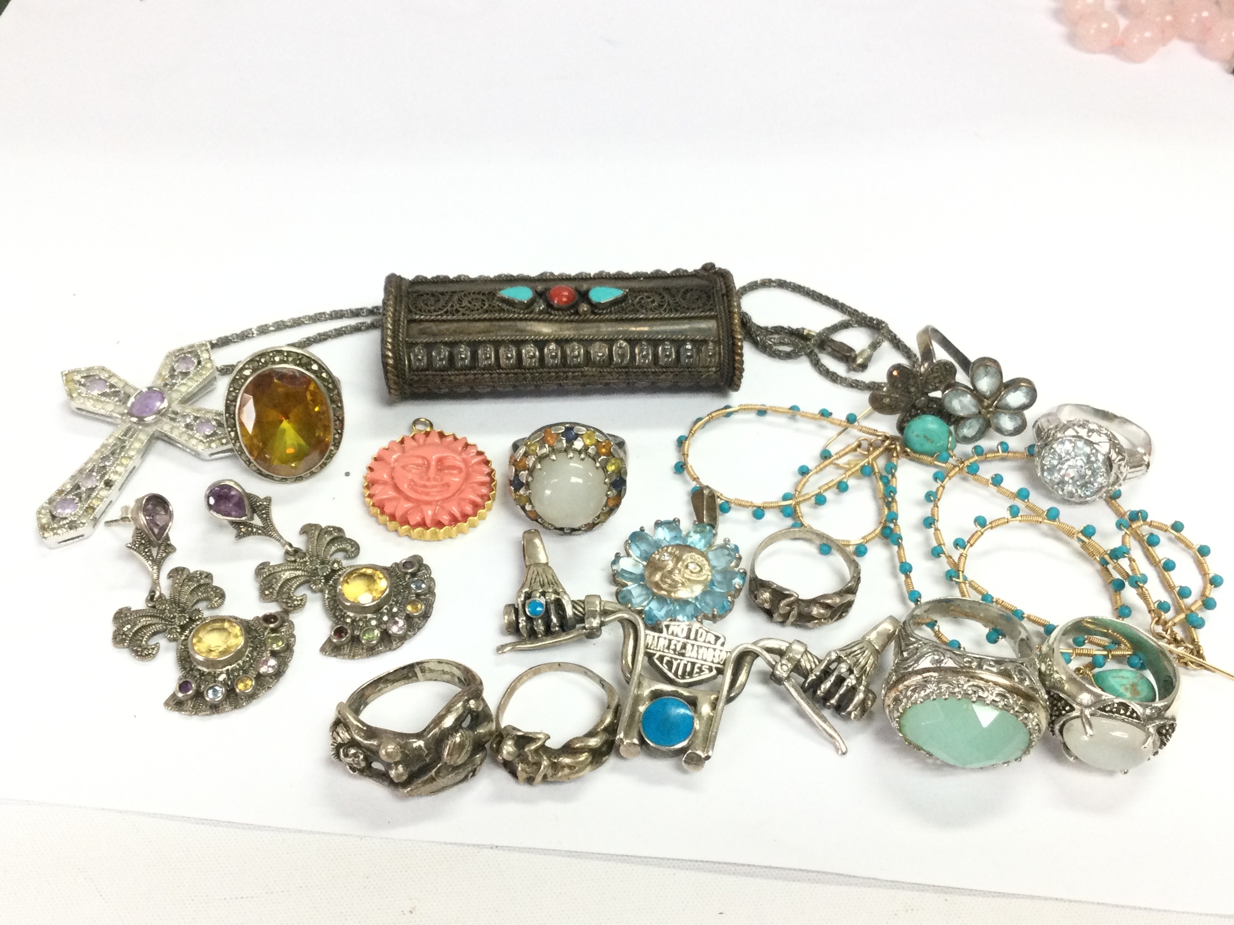 A collection of silver jewellery including pendants, silver rings etc 