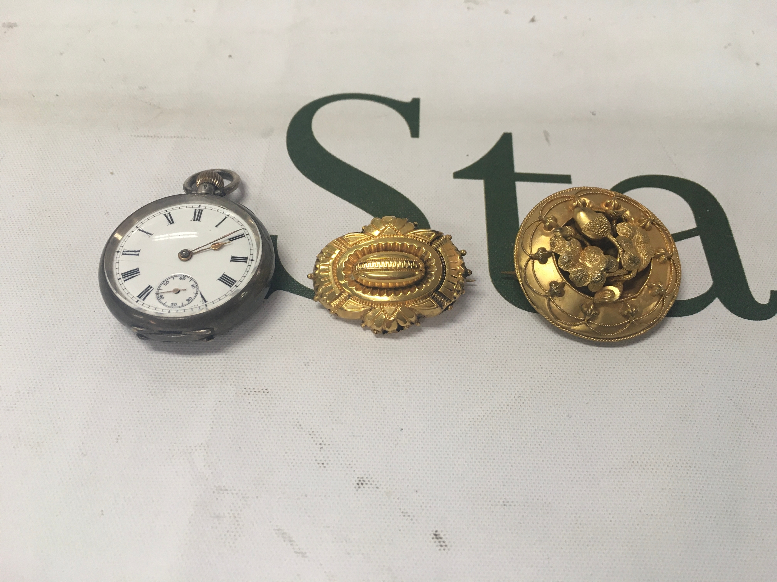 2 victorian morning brooches and an omega pocket watch 