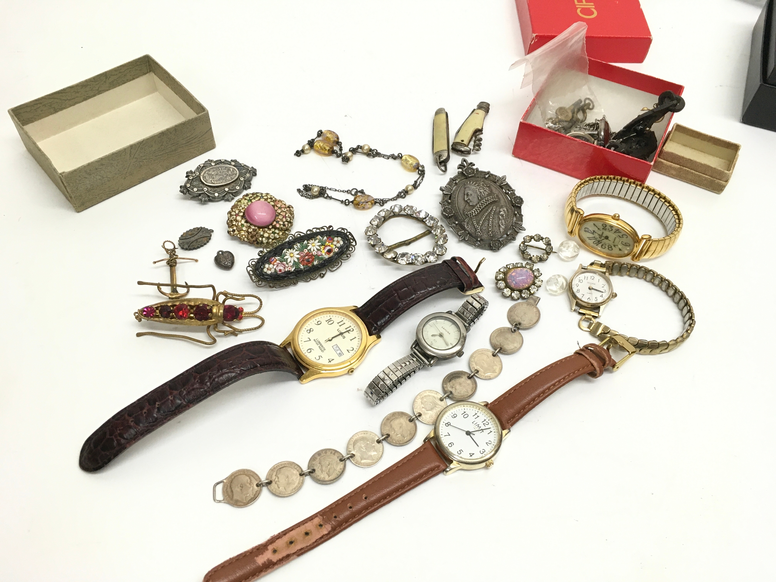 A collection of costume jewellery including watches, brooches etc. small ceramic pin up style dish ashtray
