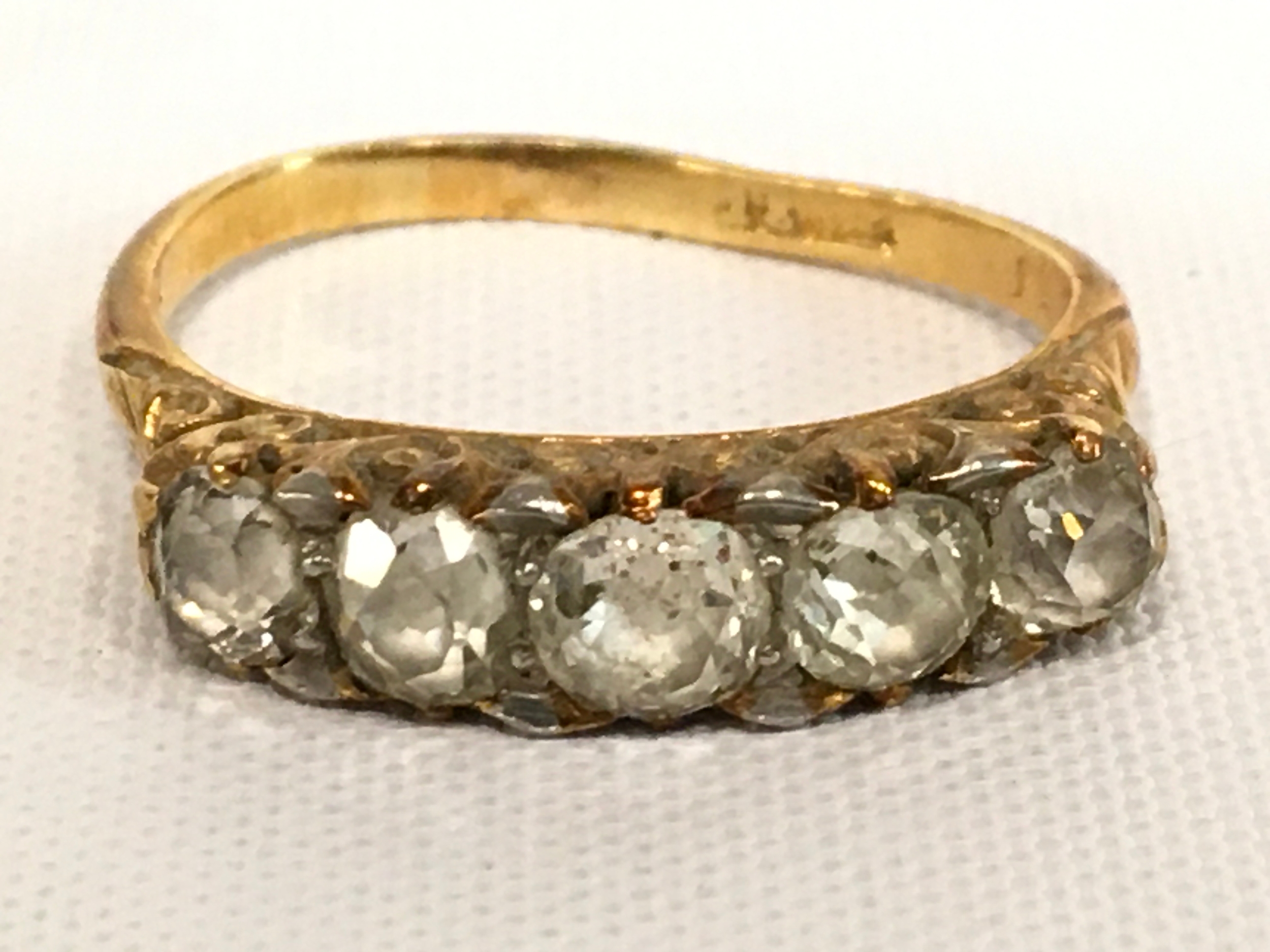 An 18ct gold five stone diamond ring , 3.8g total weight 