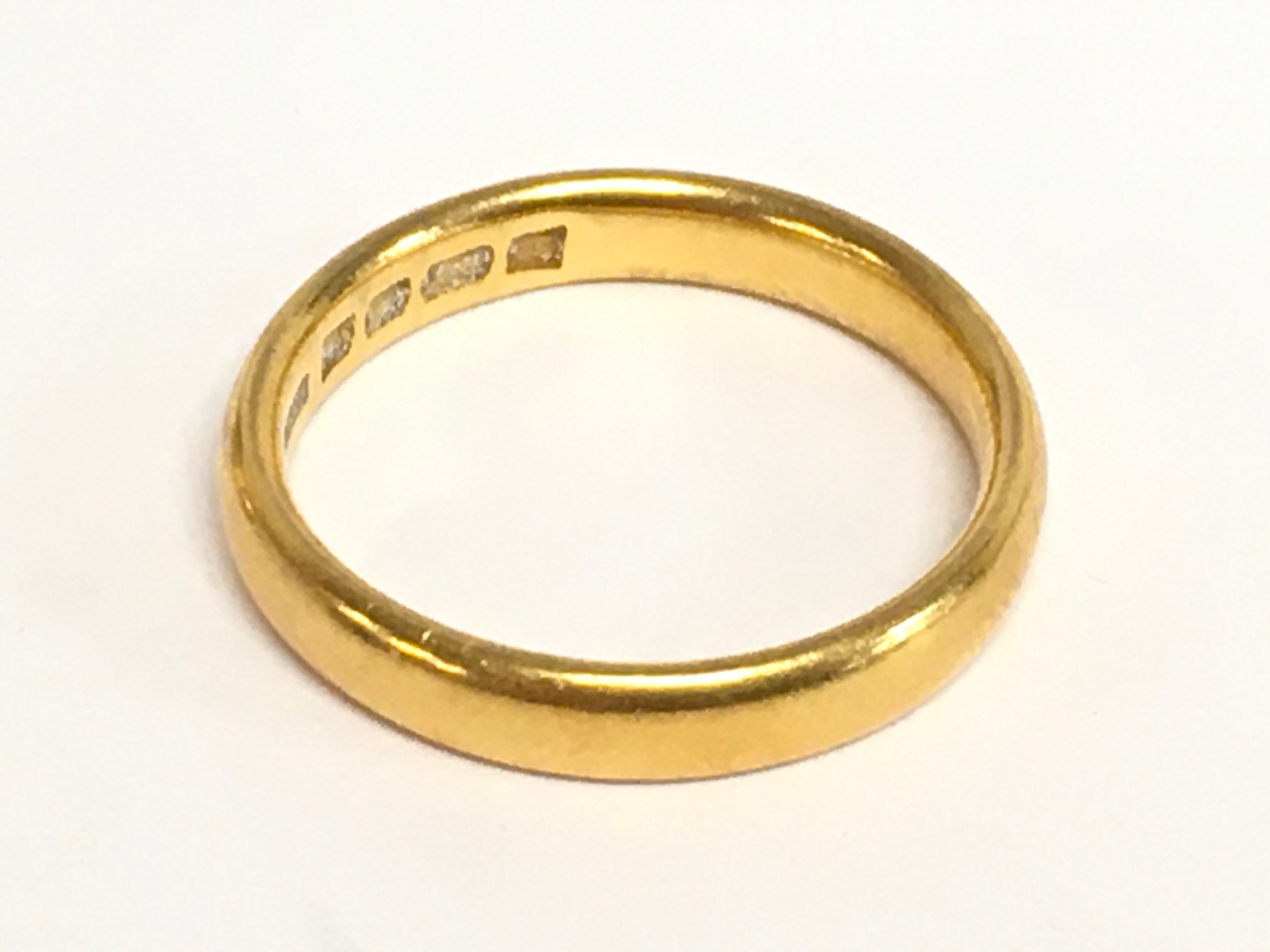 A 22ct gold wedding band ring, size U, 7.6g total weight 