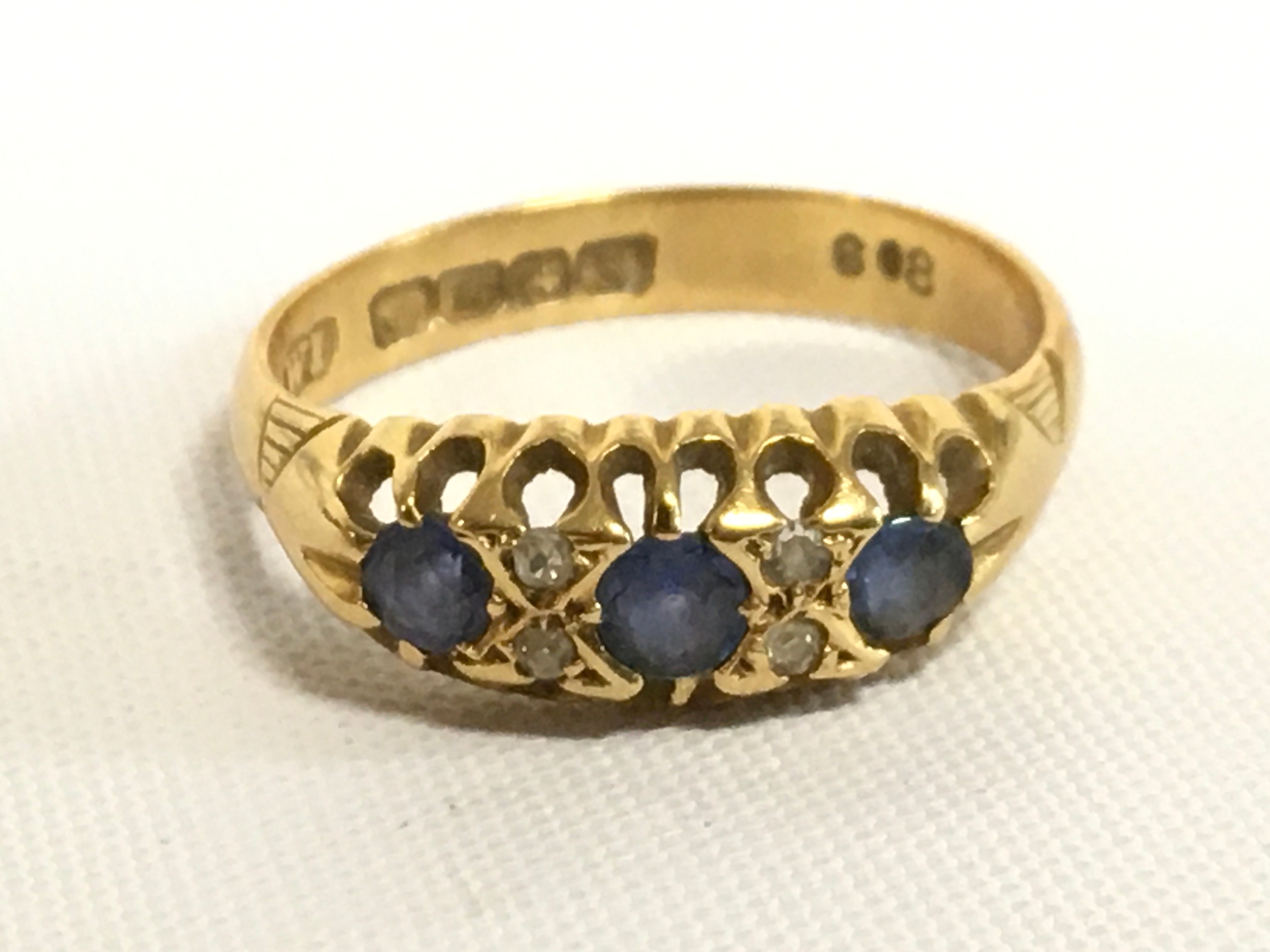 An 18ct gold sapphire and diamond ring, size R, 3.7g