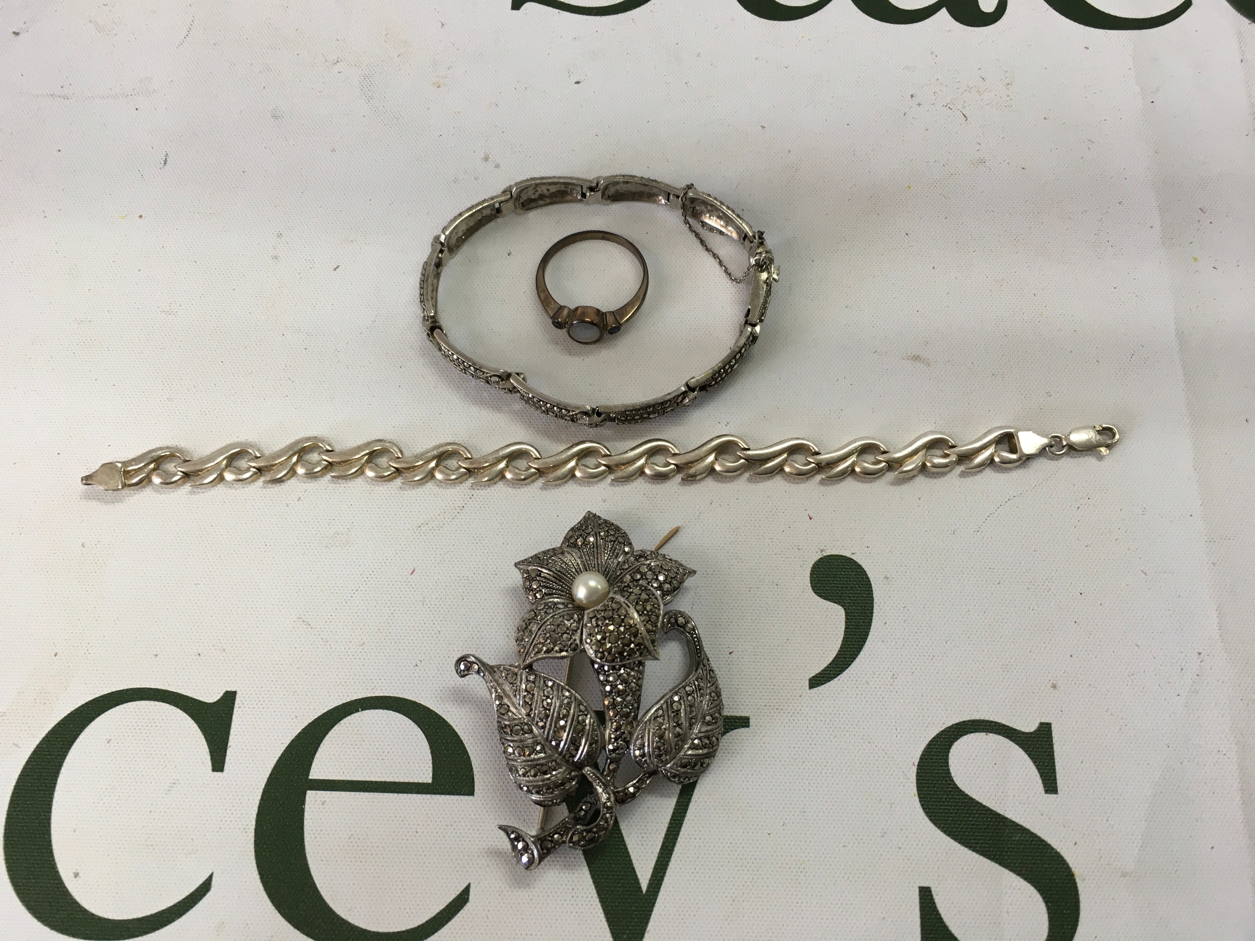 Silver bracelets ring and marcasite brooch.