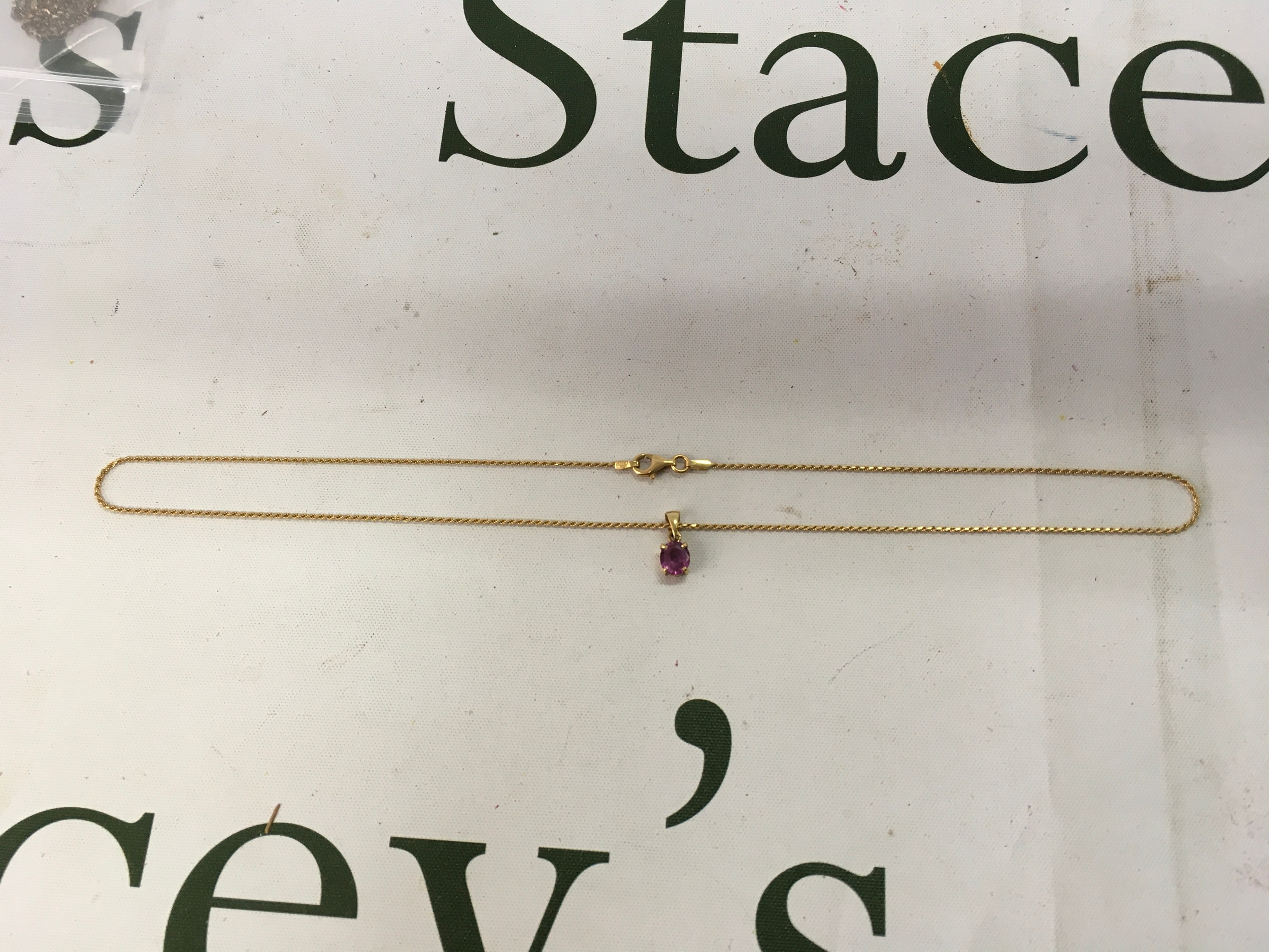 18ct chain and pendant with pink sapphire. 4.5gram 18 inch chain.