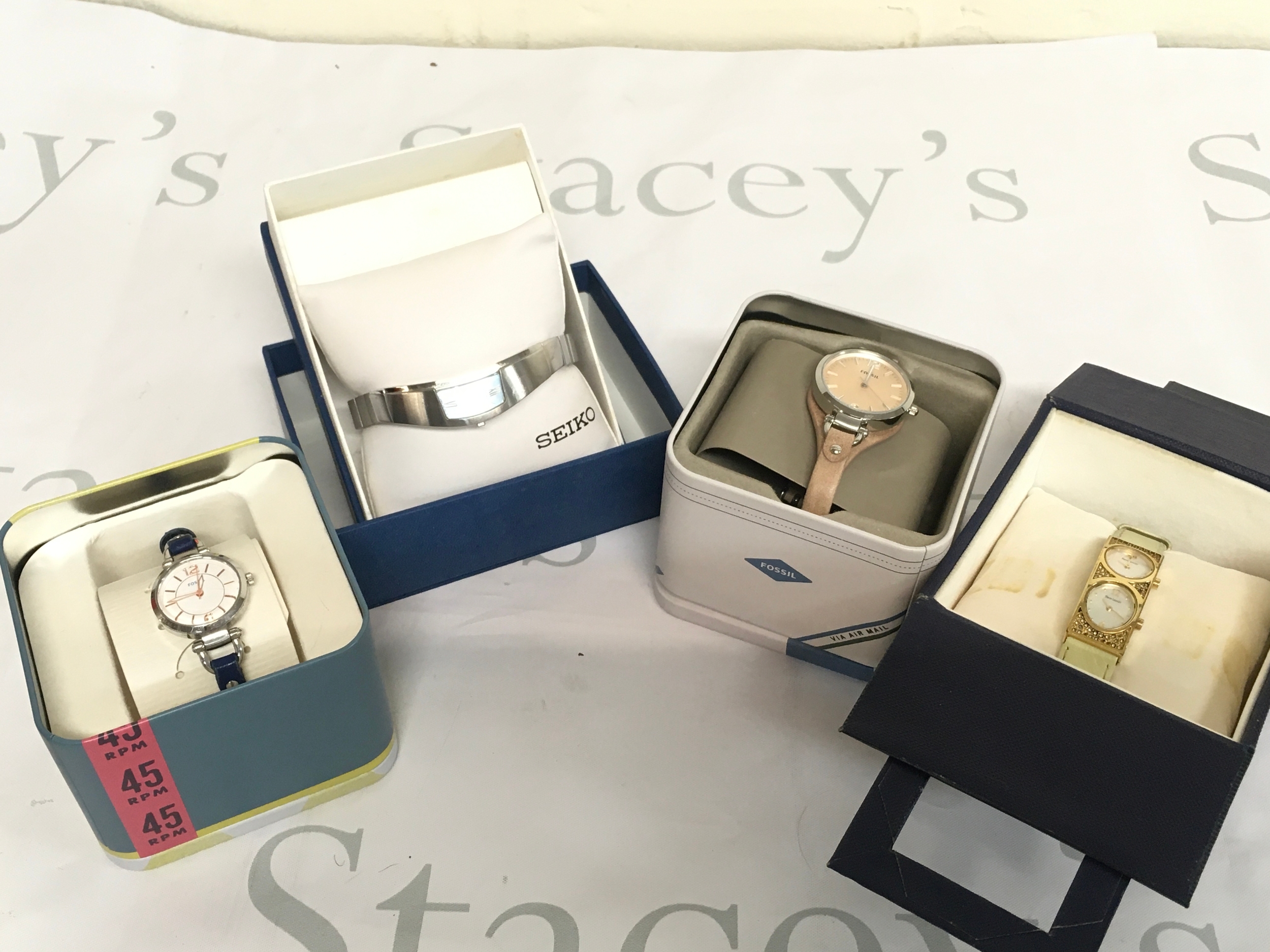 Four boxed watches including Fossil, Seiko, Pierre Lannier