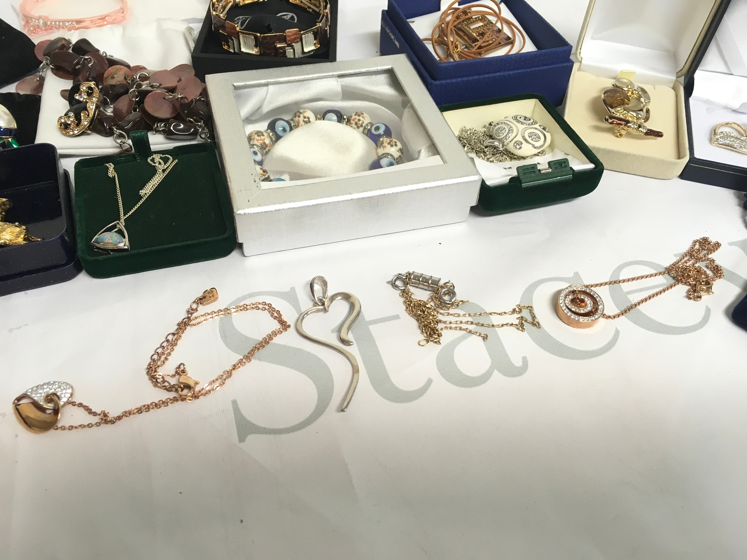 A collection of costume jewellery including Swarovski necklaces, brooches, other necklaces , most items boxed 