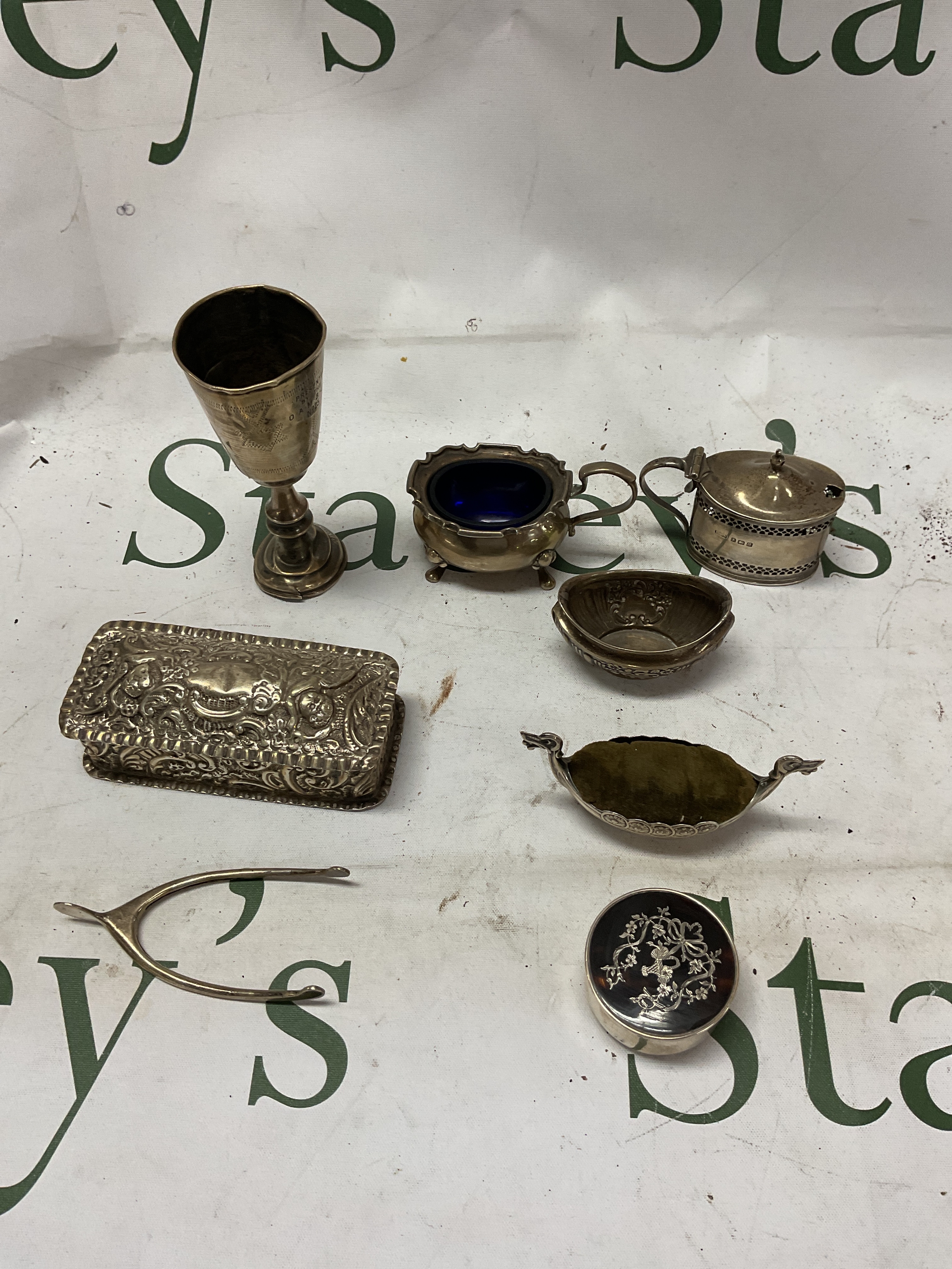 HM silver items to include Kiddish cup, cruet, pin cushion, lidded box, tortoiseshell box and wishbone sugar snips.over 200 grams 