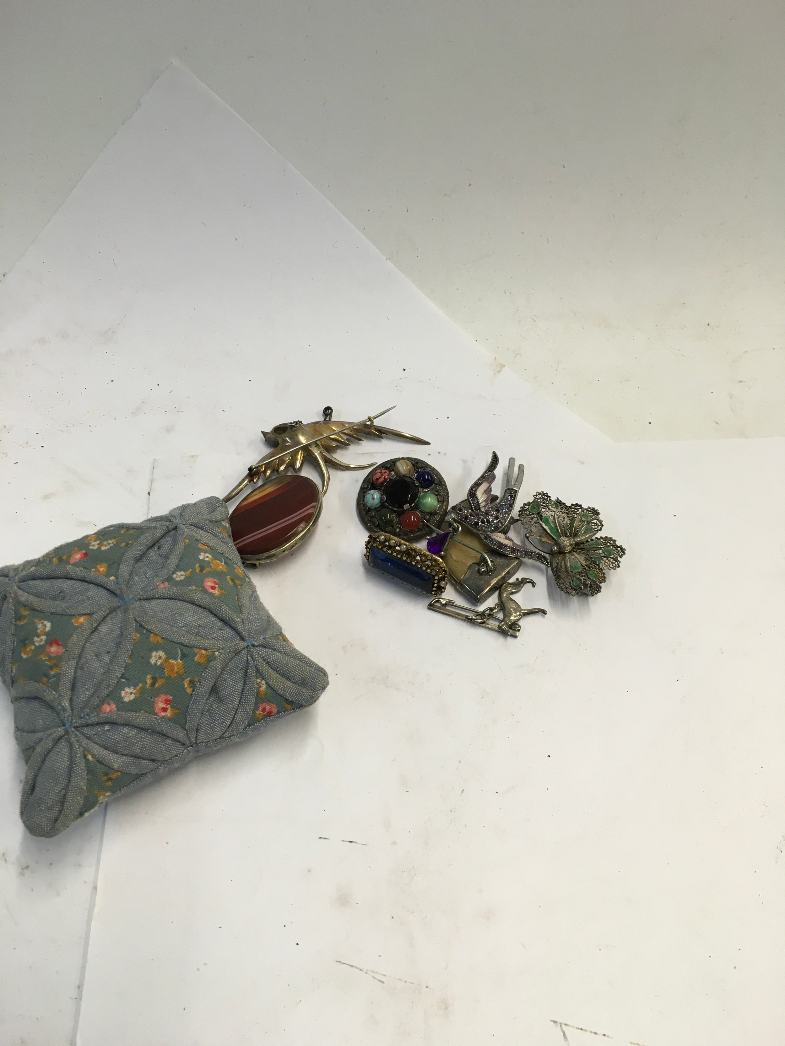 A collection of various brooches including a Sterling Silver brooch 