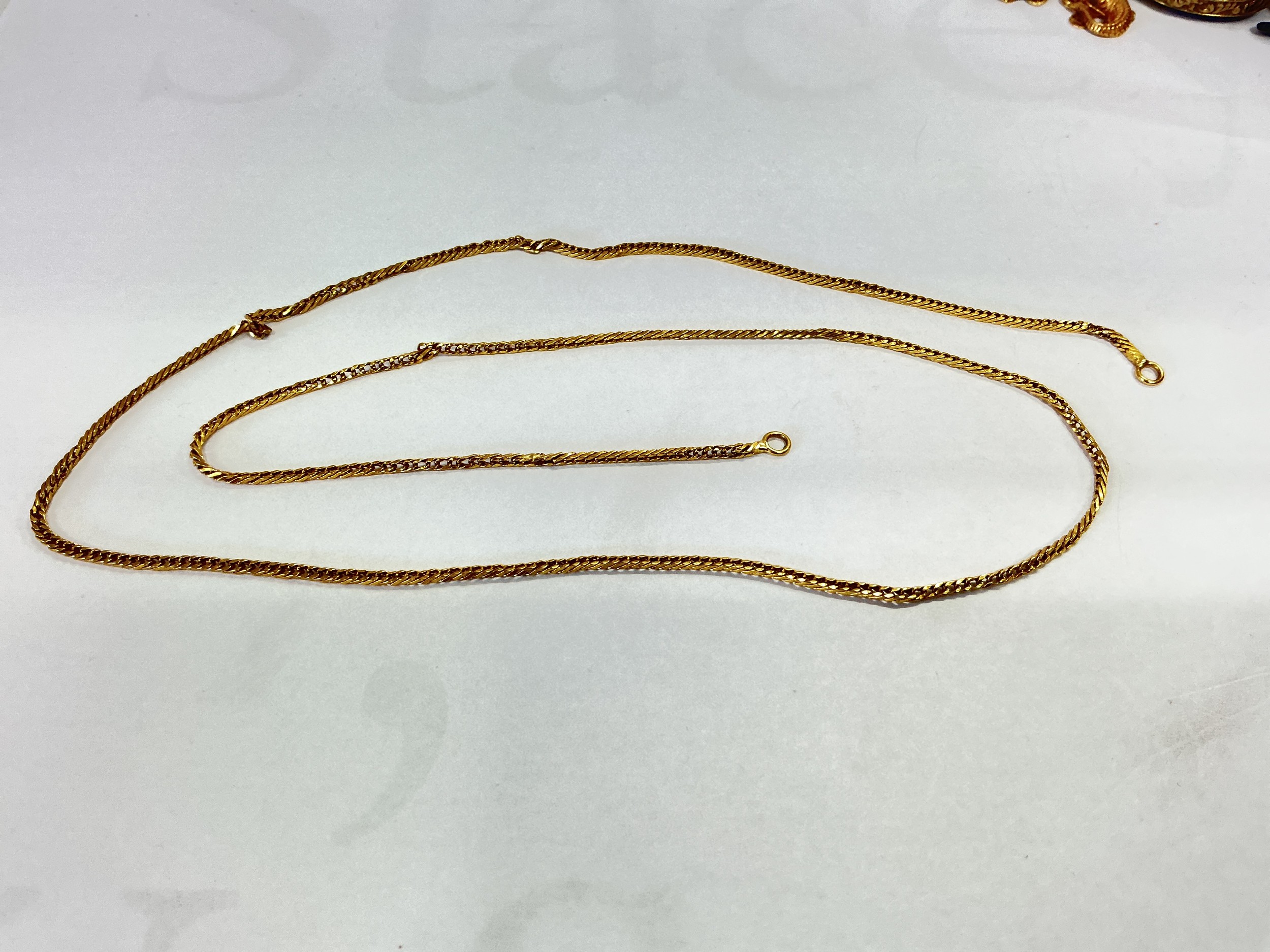 A high grade gold chain, possibly 18ct, approx 63cm and approx 13g.