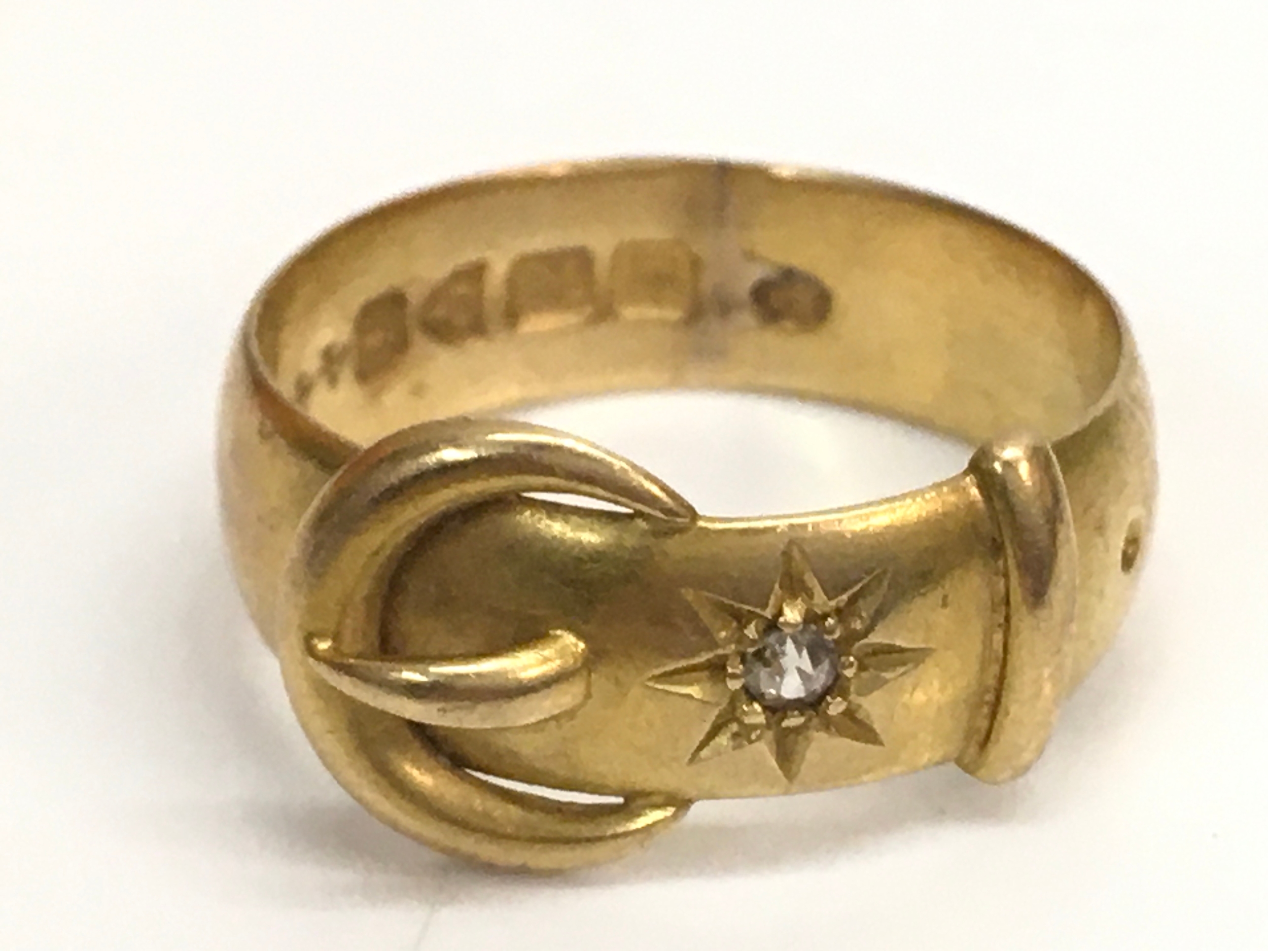An 18ct gold buckle ring, size O. 5.3G total weight 