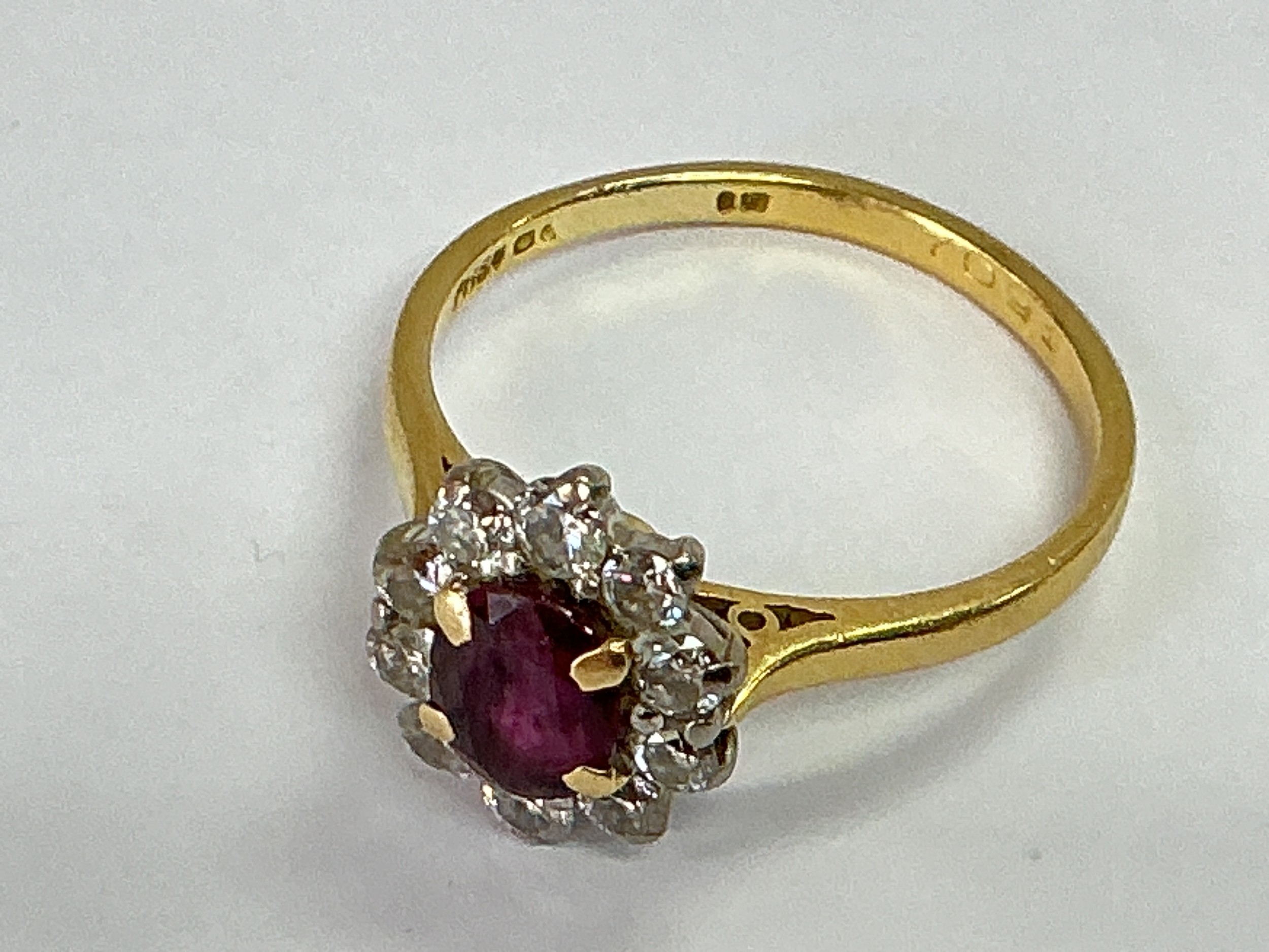 A gold, diamond and ruby ring, hallmarks indistinct, approx 3.8g and approx size R.
