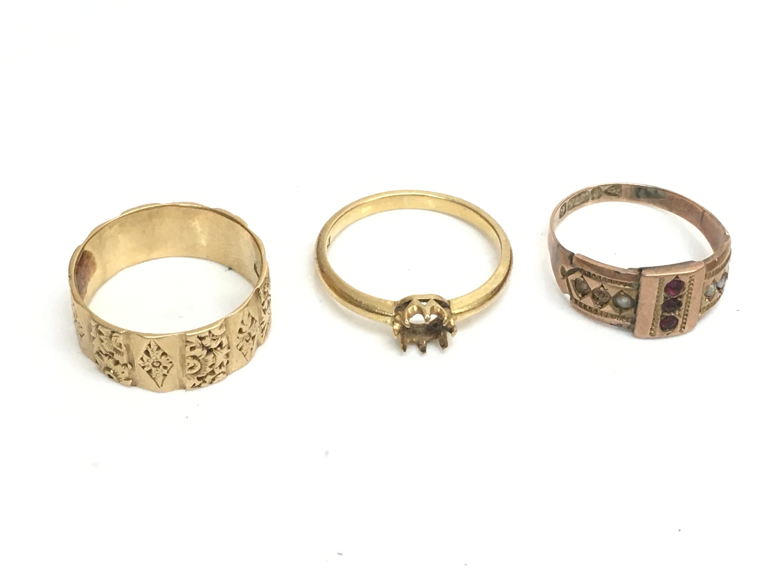 Three gold rings, size M. 8.7g total weight 