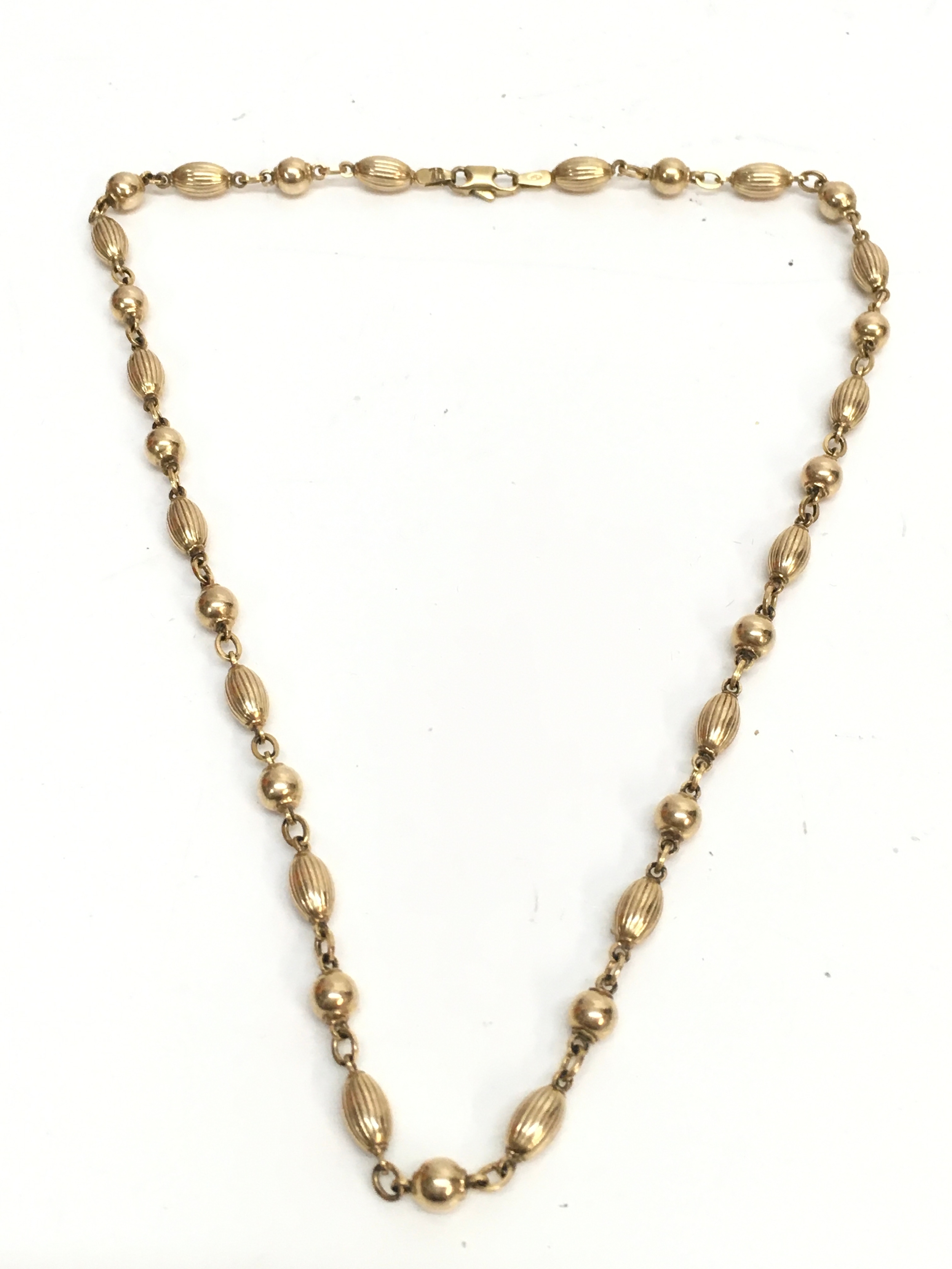 A 9ct gold chain, 15cm long. 13.9g total weight 