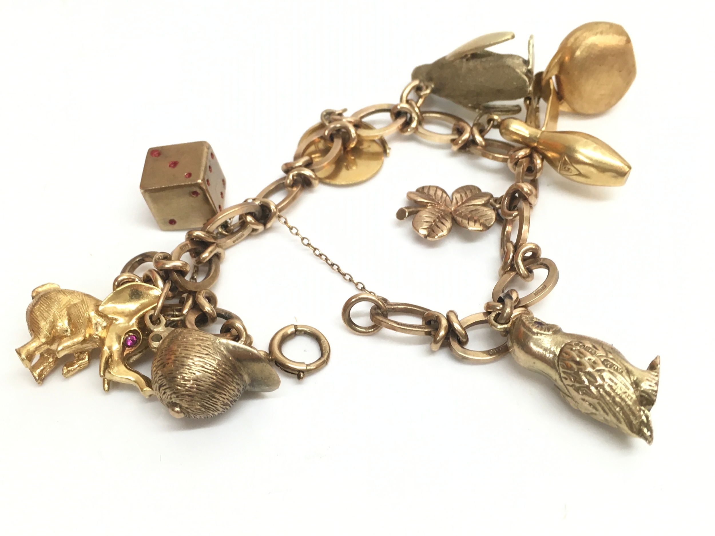 a 9ct gold charm bracelet, 41g total weight