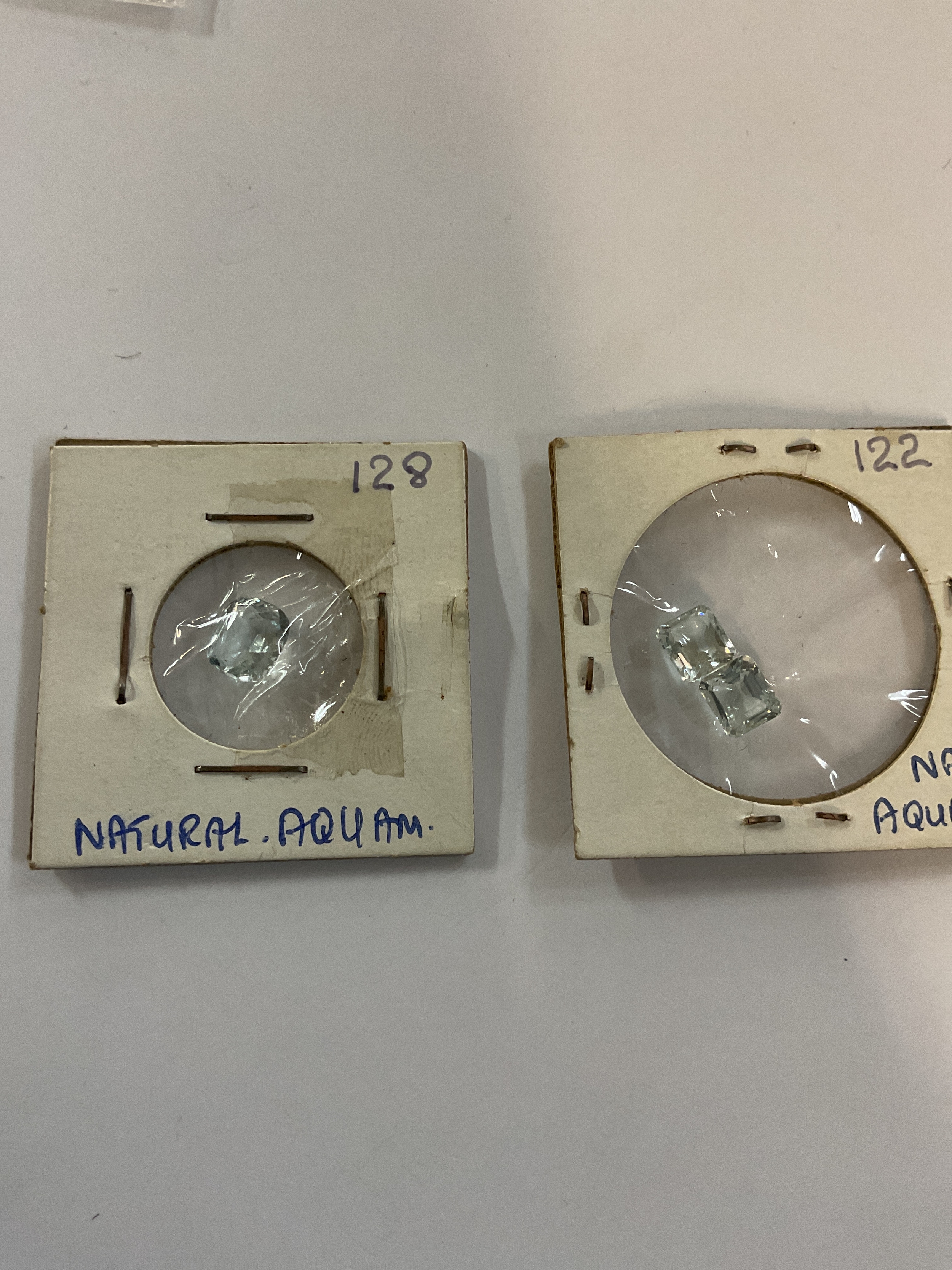 Aquamarine stones. Two Emerald cut the other cushion cut.