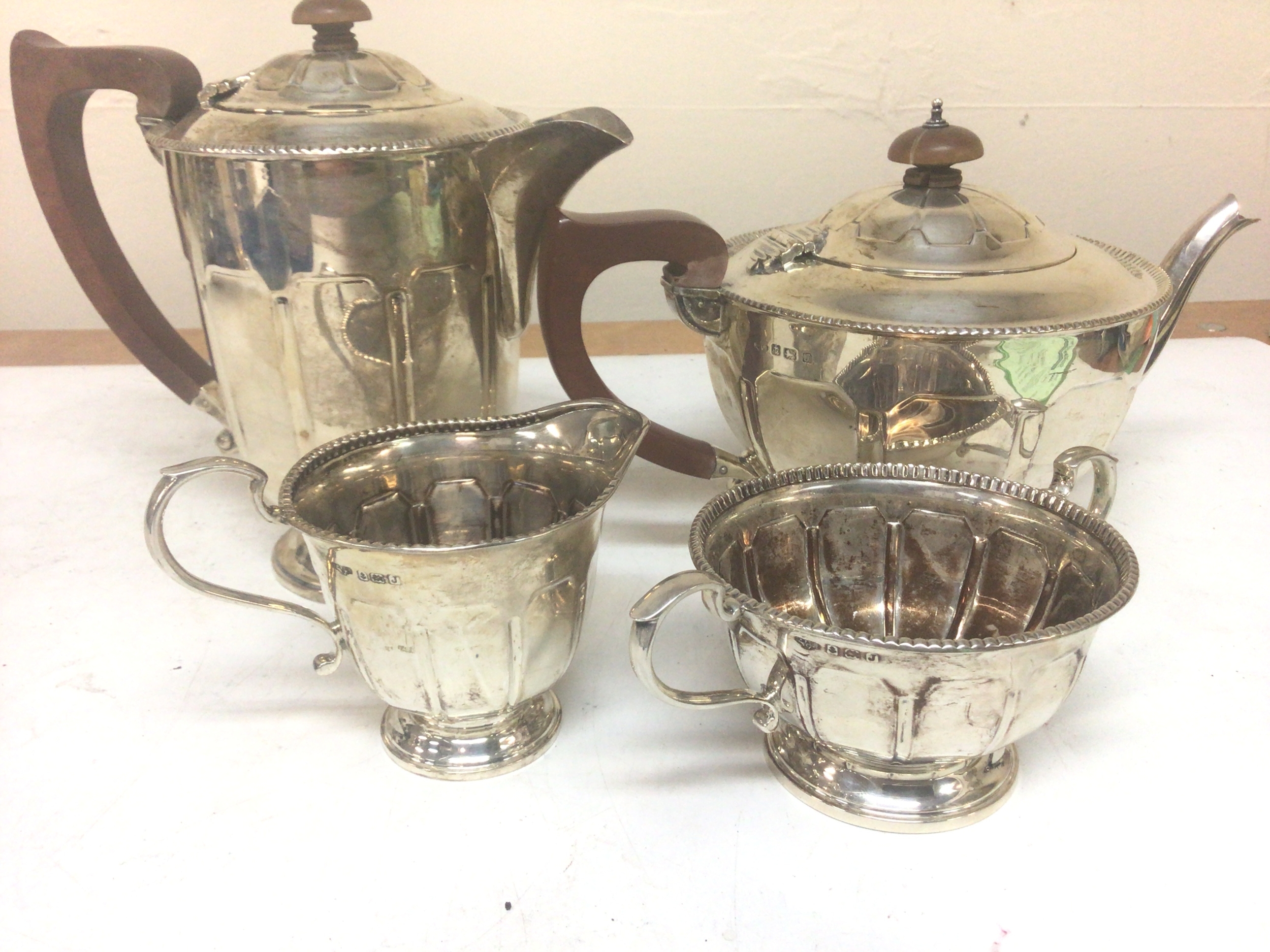  A Silver four piece tea set tea pot hot water jug sugar bowl and cream jug Birmingham hallmarks marks total weight 1070g approximately. (4) 