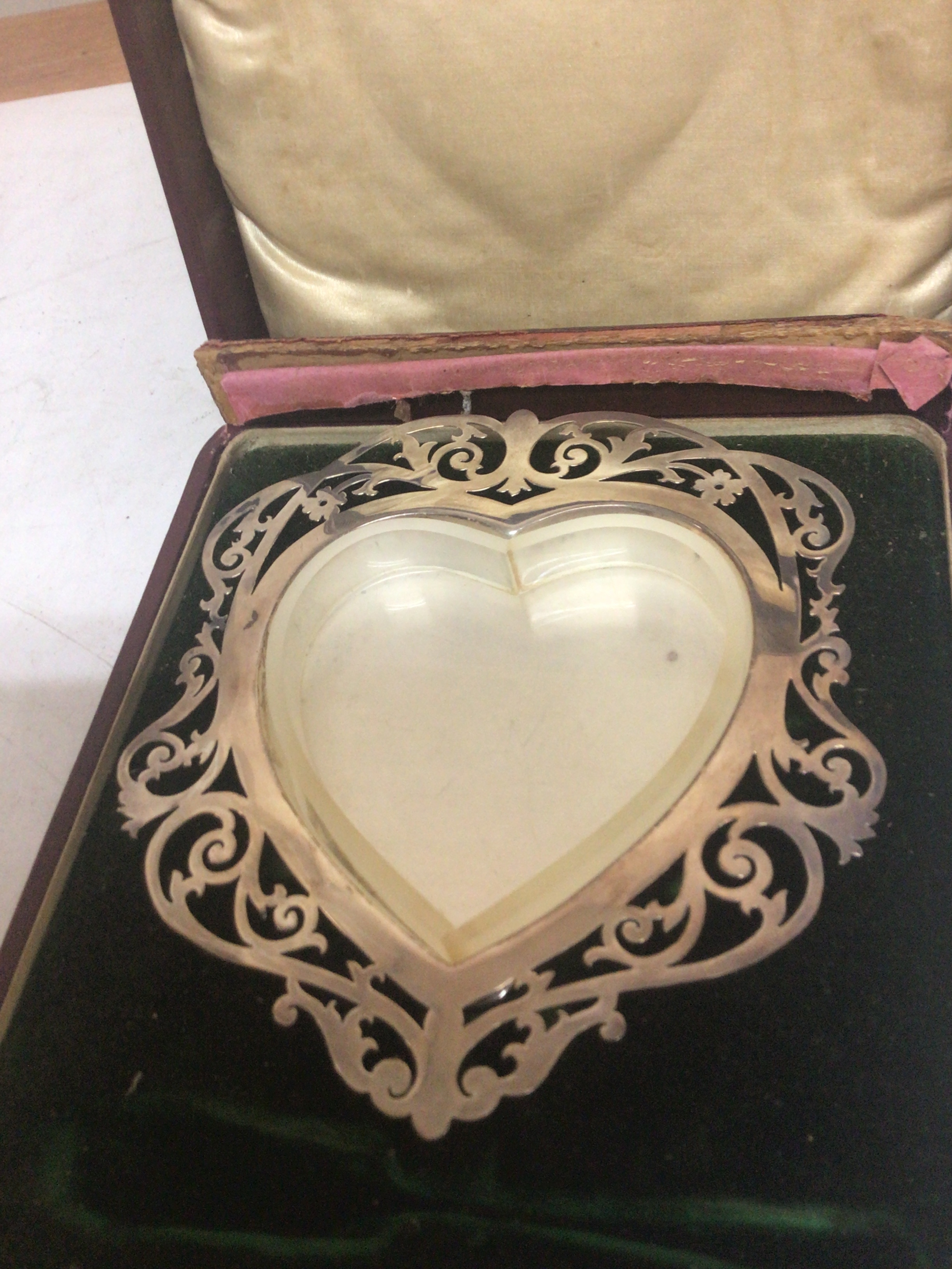  A silver butter dish of heart shape with a pierced edge and glass liner Birmingham hallmarks 